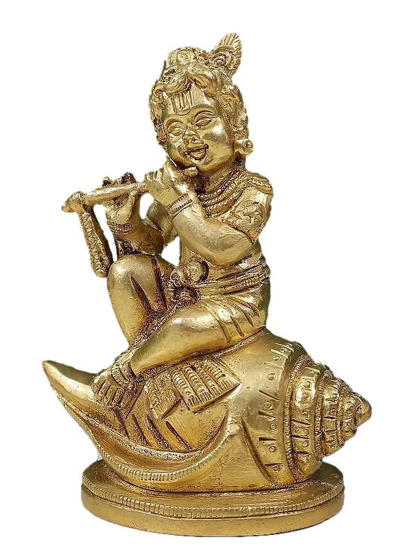 Baby Krishna Seated on Conch Playing the Flute In Brass